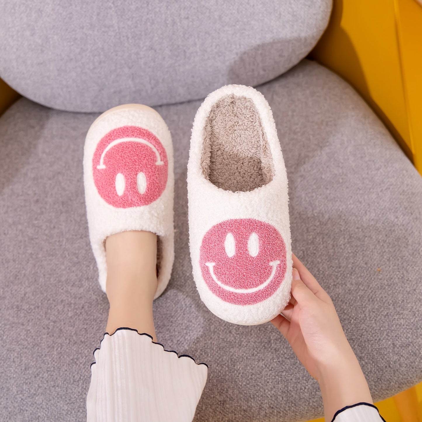 Melody Smiley Face Slippers with cute design and faux fur material.