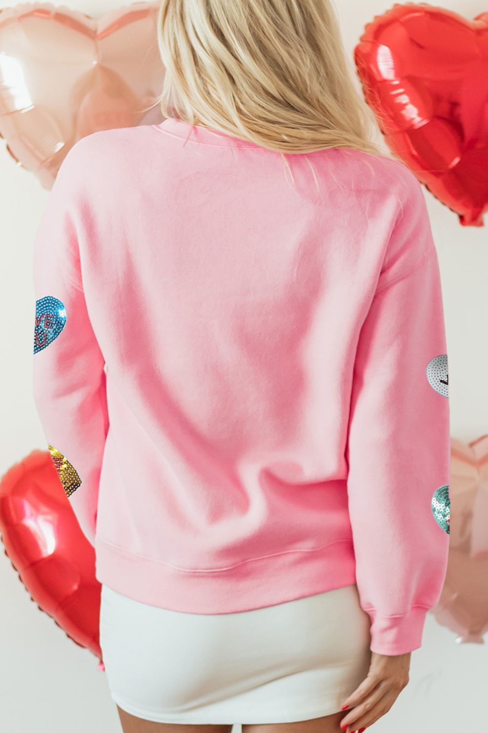 Valentine’s Day sequin heart round neck long sleeve pink sweatshirt.