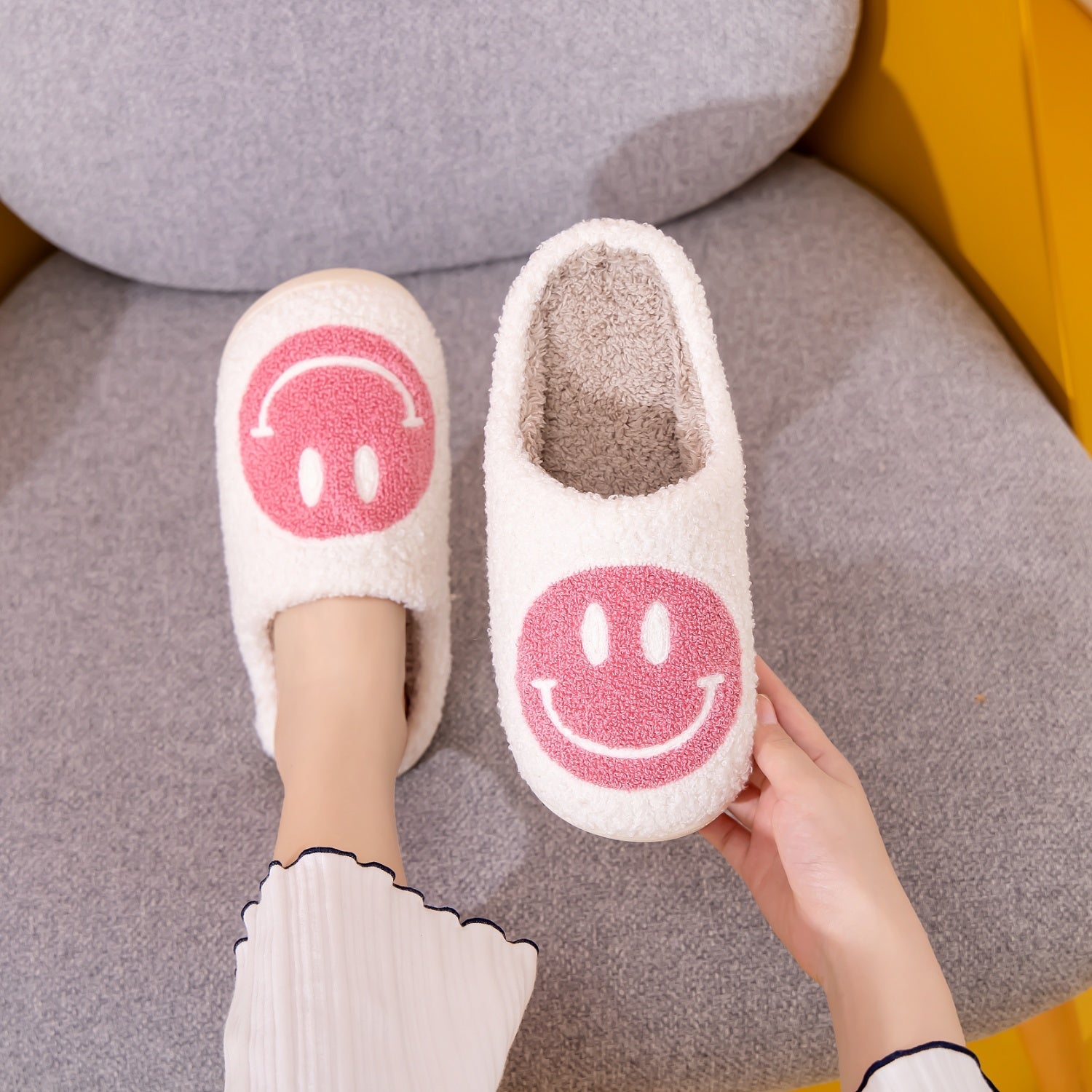 Melody Smiley Face Slippers with cute design and faux fur material.